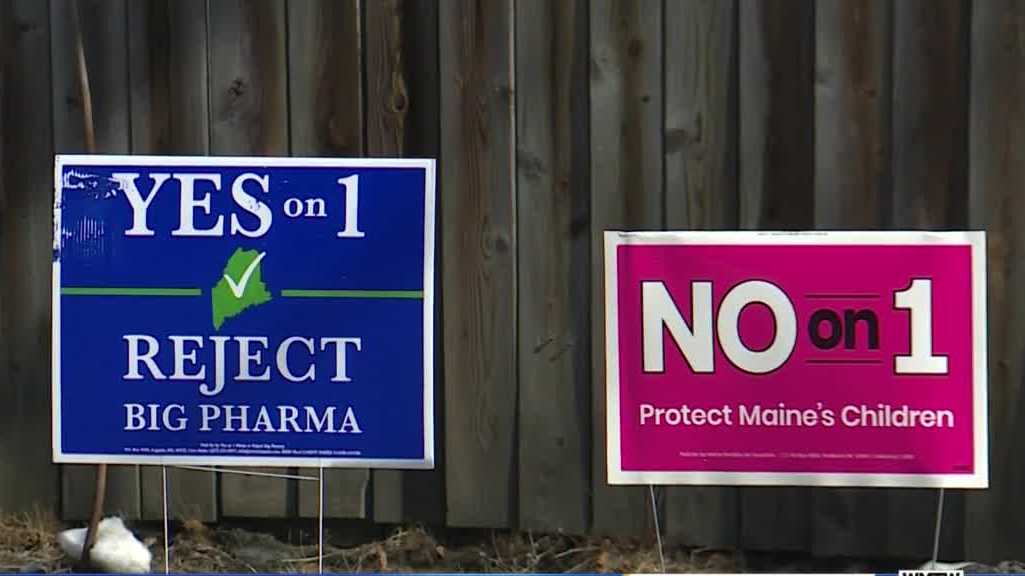 Yes on 1 political sign reading "reject big pharma" next to another political sign reading "No on 1, protect Maine's children"